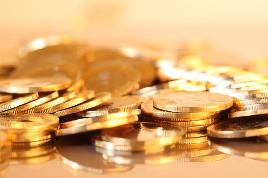 gold coins in shiny surface gold coins in shiny surface