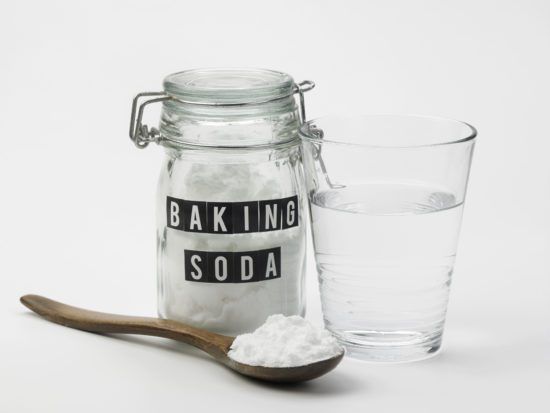 jar or baking soda cup of water and spoon with baking soda