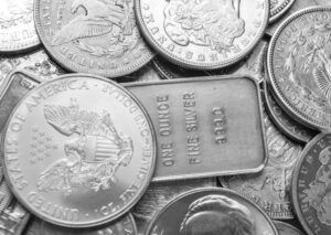 silver coin dollar and silver bars