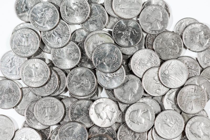 silver quarters in a pile